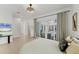 Spacious bedroom with patio access overlooking the pool and modern decor at 6028 Red Mangrove Ln, Bradenton, FL 34210