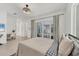 Bedroom featuring a patio view, modern decor, and light wood flooring at 6028 Red Mangrove Ln, Bradenton, FL 34210