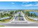 Wide aerial view of the Aqua community entrance, showcasing the landscaped median and entry gate at 6028 Red Mangrove Ln, Bradenton, FL 34210
