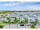 Waterfront community with white modern style homes and palm tree lined streets at 6028 Red Mangrove Ln, Bradenton, FL 34210