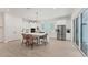 Modern kitchen with white cabinetry, a large island, and stainless steel appliances at 6028 Red Mangrove Ln, Bradenton, FL 34210
