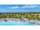 Breathtaking view of the blue lagoon, with soft sand and palm trees, perfect for relaxation and leisure at 6028 Red Mangrove Ln, Bradenton, FL 34210