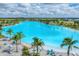 A sprawling turquoise lagoon with palm-lined beaches, creating a serene and tropical oasis at 6028 Red Mangrove Ln, Bradenton, FL 34210