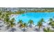 Beautiful lagoon with palm-lined beaches, perfect for lounging and enjoying waterfront community amenities at 6028 Red Mangrove Ln, Bradenton, FL 34210