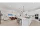 Spacious living room with recessed lighting, sleek furnishings, and easy access to the kitchen at 6028 Red Mangrove Ln, Bradenton, FL 34210