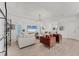 Spacious living room with modern lighting, stylish furniture, and an open-concept design at 6028 Red Mangrove Ln, Bradenton, FL 34210