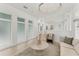 A bright and modern living room with a neutral color palette, stylish lighting, and ample natural light at 6028 Red Mangrove Ln, Bradenton, FL 34210