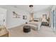 Bright bedroom featuring a platform bed, stylish lighting, and modern decor at 6028 Red Mangrove Ln, Bradenton, FL 34210