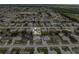 Aerial view of a cozy home nestled in a tranquil neighborhood with a private pool and green landscape at 6178 Coliseum Blvd, Port Charlotte, FL 33981