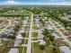 Scenic aerial view showcasing a well-planned neighborhood with lush greenery and neatly arranged homes at 6178 Coliseum Blvd, Port Charlotte, FL 33981