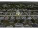 Aerial view showcasing the home with pool and backyard, nestled in a residential community at 6178 Coliseum Blvd, Port Charlotte, FL 33981