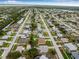 Expansive aerial shot of a residential community with a winding river, lush trees, and neatly aligned streets at 6178 Coliseum Blvd, Port Charlotte, FL 33981