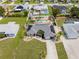 Aerial view of home with pool, patio, and lush landscaping at 6178 Coliseum Blvd, Port Charlotte, FL 33981