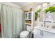 Bathroom featuring a shower, sink, mirror, plants and storage at 6178 Coliseum Blvd, Port Charlotte, FL 33981