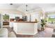 Bright kitchen with a breakfast bar, stainless steel appliances, and tile flooring at 6178 Coliseum Blvd, Port Charlotte, FL 33981