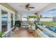 Relaxing patio with comfortable seating, fan, string lights, and view of the backyard at 6178 Coliseum Blvd, Port Charlotte, FL 33981