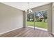 Dining room with sliding glass doors providing backyard views and natural light at 6352 Robin Cv, Lakewood Ranch, FL 34202