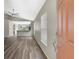 An inviting entryway featuring wood-look flooring, neutral paint, and natural light from the window at 6352 Robin Cv, Lakewood Ranch, FL 34202