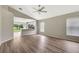 Open-concept living room showcasing modern floors, neutral walls, recessed lighting, and seamless flow to the kitchen at 6352 Robin Cv, Lakewood Ranch, FL 34202