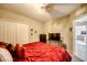 Cozy bedroom with carpet floors, a ceiling fan, and an organized closet at 640 Encarnacion St, Punta Gorda, FL 33983