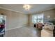 Light filled room showcasing a charming corner desk near the window and neutral tile flooring at 640 Encarnacion St, Punta Gorda, FL 33983