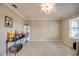 A light filled room with neutral tile flooring showcasing a view from the window at 640 Encarnacion St, Punta Gorda, FL 33983