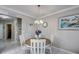 Dining area featuring tile floors and neutral paint with a view to a kitchen at 640 Encarnacion St, Punta Gorda, FL 33983