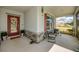 Charming front porch with comfortable chairs and tasteful decor enhancing curb appeal at 640 Encarnacion St, Punta Gorda, FL 33983