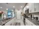 Bright kitchen with granite countertops, stainless steel appliances, and white cabinets at 640 Encarnacion St, Punta Gorda, FL 33983