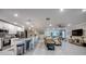 Expansive open-concept living room with a modern kitchen and comfortable seating area at 640 Encarnacion St, Punta Gorda, FL 33983