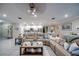 Spacious open-plan living room featuring a large sectional sofa and access to the kitchen at 640 Encarnacion St, Punta Gorda, FL 33983