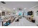 Open concept living area with seamless transition to kitchen, complete with comfortable seating and modern entertainment setup at 640 Encarnacion St, Punta Gorda, FL 33983