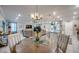 Open floor plan with table and chairs overlooking the living room and kitchen at 640 Encarnacion St, Punta Gorda, FL 33983