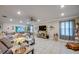 Spacious living room with modern furnishings, ample natural light, and a seamless flow to the outdoor spaces at 640 Encarnacion St, Punta Gorda, FL 33983