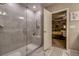 Tiled walk-in shower with glass door, bench, and a view into the bedroom at 640 Encarnacion St, Punta Gorda, FL 33983