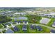 Aerial view showcases a residential neighborhood with community ponds at 6435 165Th E Dr, Parrish, FL 34219