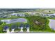Desirable neighborhood featuring well-maintained homes, lush landscaping, and picturesque pond views at 6435 165Th E Dr, Parrish, FL 34219