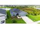 Areal view showing the manicured lawn and the beautiful landscaping at 6435 165Th E Dr, Parrish, FL 34219