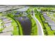Stunning aerial view of a Primary-planned community featuring a pool, clubhouse, and scenic water views at 6435 165Th E Dr, Parrish, FL 34219