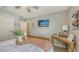 Inviting bedroom boasts a ceiling fan, wooden bed, and plenty of natural light at 6435 165Th E Dr, Parrish, FL 34219