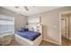 Cozy bedroom featuring a stylish built-in bookcase headboard and a comfortable-looking daybed at 6435 165Th E Dr, Parrish, FL 34219