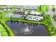 A view of the community pool, tennis courts, and playground with the pond view at 6435 165Th E Dr, Parrish, FL 34219