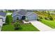 Charming single Gathering home featuring a two-car garage and a beautifully landscaped front yard at 6435 165Th E Dr, Parrish, FL 34219