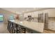 Stylish kitchen features an oversized island with seating, stainless appliances, and ample counter space at 6435 165Th E Dr, Parrish, FL 34219