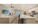 Spacious living area featuring a kitchen island with seating and a comfortable sectional couch at 6435 165Th E Dr, Parrish, FL 34219