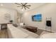 Comfortable sectional couch in living room with entertainment center and wall decor at 6435 165Th E Dr, Parrish, FL 34219