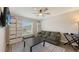 Cozy living room featuring comfortable seating, modern decor, and plenty of natural light from the large window at 6435 165Th E Dr, Parrish, FL 34219