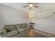 Comfortable living room with a cozy sofa, stylish decor, and a ceiling fan for added comfort at 6435 165Th E Dr, Parrish, FL 34219