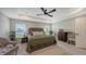 Relaxing main bedroom with a plush bed, comfortable seating area, and a serene atmosphere at 6435 165Th E Dr, Parrish, FL 34219
