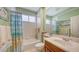 Traditional bathroom with sink, vanity, tub and shower combination at 7012 Treymore Ct, Sarasota, FL 34243
